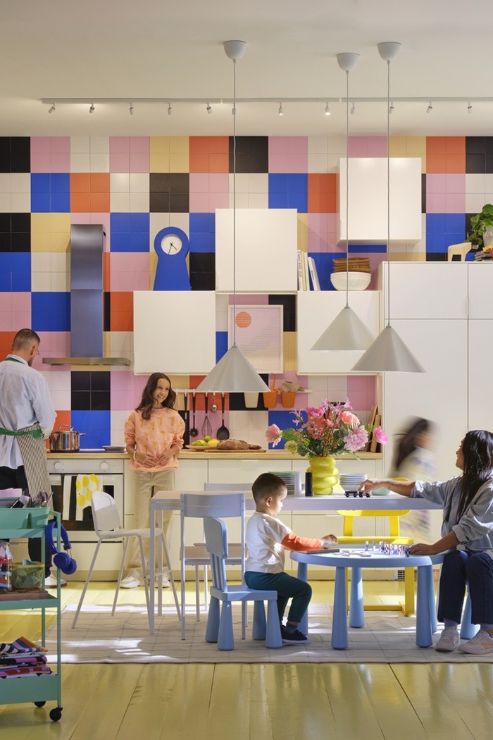 A colourful family kitchen full of life, with family members cooking, crafting, and spending time together.
