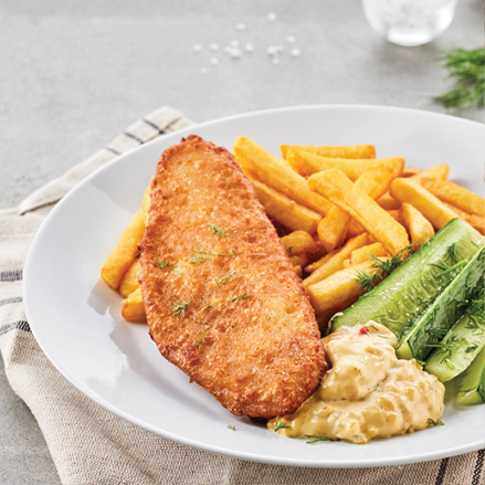 Dish at the Swedish Restaurant: cod fillet in batter with French fries, cucumbers, mayonnaise, barbecue sauce, fresh dill and cucumber-mustard salad