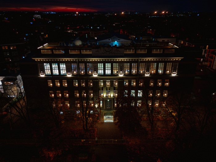 A direct view from high above the Kalamaja building of Gustav Adolf Gymnasium, with the STRÅLA stars shining in the darkness on the windows.