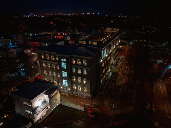 A side view from high above the Kalamaja building of Gustav Adolf Gymnasium, with the STRÅLA stars shining in the darkness on the windows.
