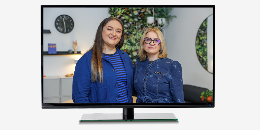 IKEA interior designer, wearing a blue uniform, stands next to the head of the Vilnius City Crisis Centre.